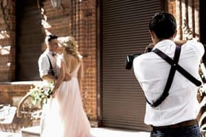 Wedding photographer working on a shoot with AUZi Insurance